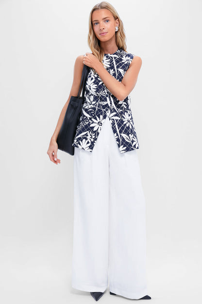 Model showcasing classic Black Eleanor Heels with pointed toes and block heels, paired with an effortless ensemble of navy top and white trousers, exuding a high-end, fun vibe.