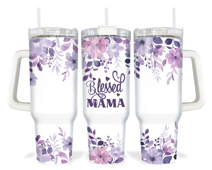 A 40oz tumbler with a white handle featuring a purple floral design and the words 'Blessed Mama'