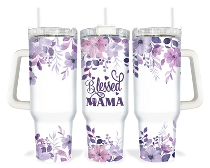 A 40oz tumbler with a white handle featuring a purple floral design and the words 'Blessed Mama'